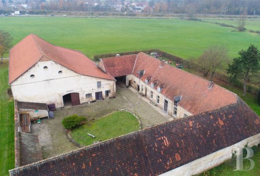 A quadrilateral farm awaiting renovation  in the Brabant province near to Brussels