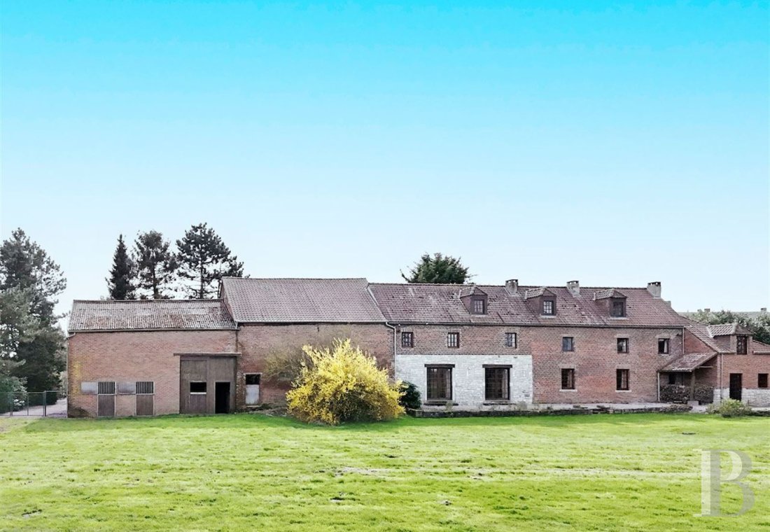 An old farmhouse awaiting renovation, with outbuildings suitable for conversion, <br/>near Charleroi in Wallonia