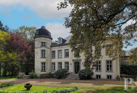 A chateau with outhouses and 10 hectares of grounds, nestled in Belgium’s Hainaut Province in Wallonia