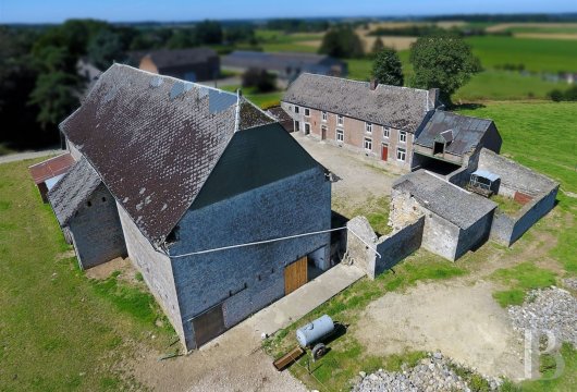 A 19th-century farm complex to be renovated, nestled in a village in Belgium’s Condroz region