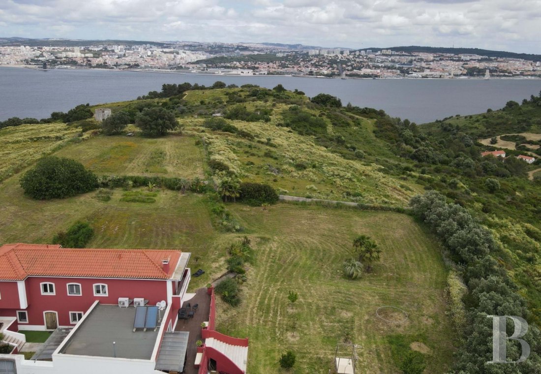 An elegant villa with a view of the River Tagus and<br/>the city of Lisbon, nestled in the Portuguese town of Trafaria