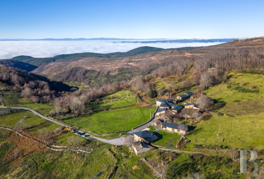 In Galicia, in the Ribeira Sacra, a group of traditional stone buildings with panoramic views, on land overlooking ...