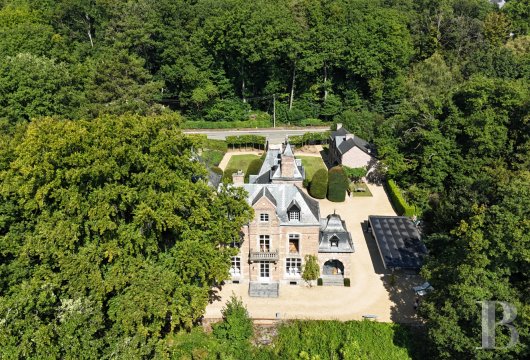 On the plateau of Namur Citadel, a contemporary manor house and its concierge building overlooking the Meuse River ...