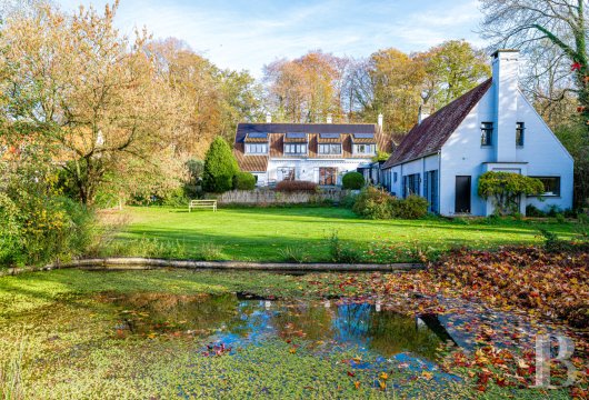 In a private, wooded estate in Walloon Brabant, a villa with a pond, an orchard, and a swimming pool