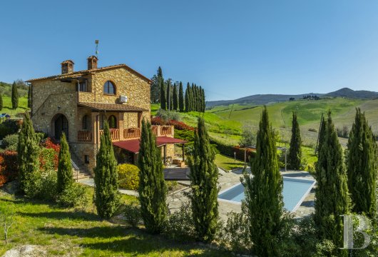 Near Volterra, a Tuscan stone villa with panoramic views over the surrounding hills