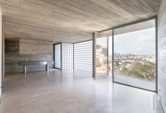 In Lisbon, a flat in a building renovated by Pedro Domingos, overlooking the rooftops of São Jorge Castle