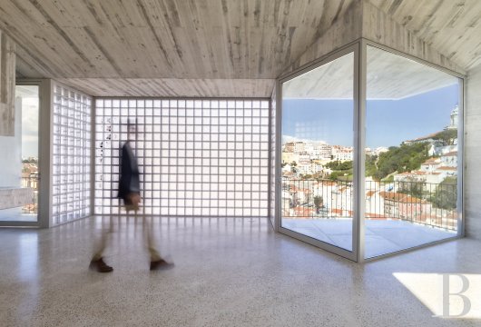 In Lisbon, a flat in a Brutalist building renovated by the architect Pedro Domingos, overlooking the rooftops of ...