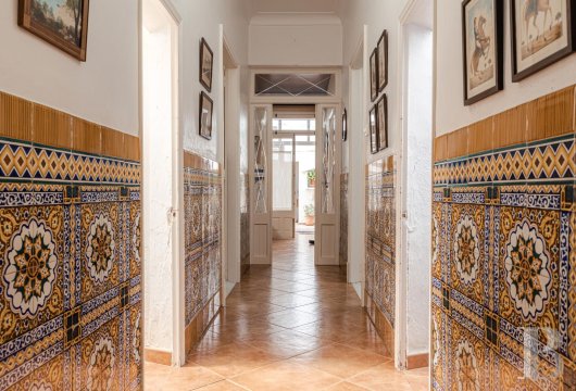 In the old town of Ciutadella, a historic house with an interior courtyard and industrial remnants