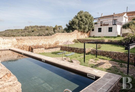 In the Mahón hinterland on Menorca, a 32-hectare estate with a main house featuring original features and farm ...