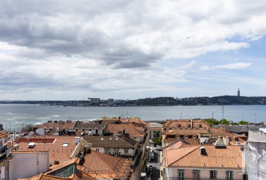 In Chiado, on the top floor of a renovated Pombaline building, a two-level apartment