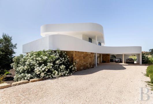 In the Algarve, on the hills above Palmares, a contemporary villa overlooking Lagos Bay, set on approximately 3,000 ...
